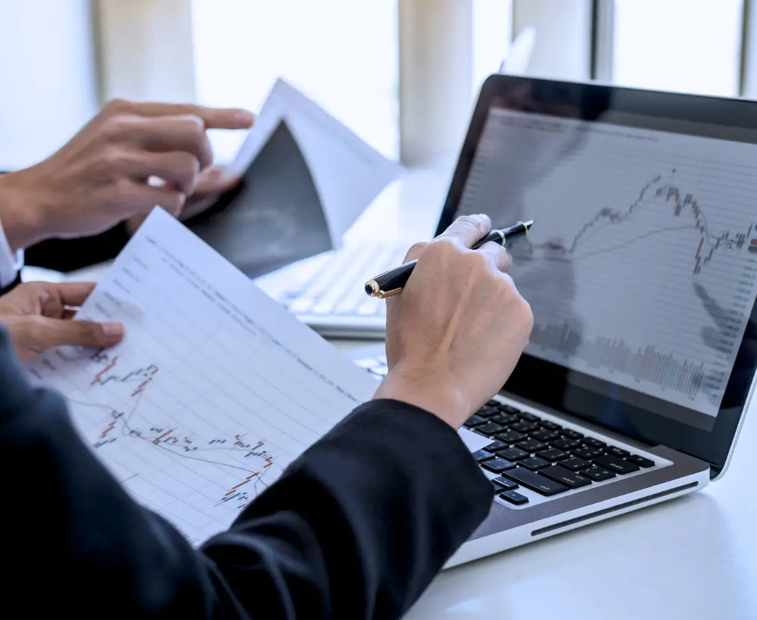 A man in marketing, writing and checking performance