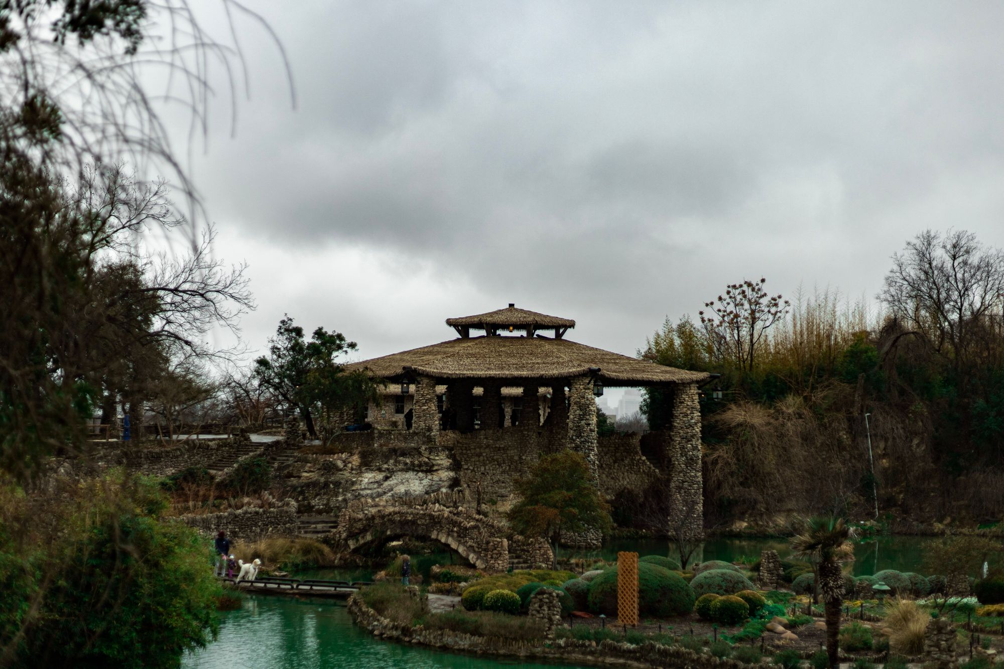 The stone pavilion and pond of the Japanese Tea Garden in San Antonio's Brackenridge Park