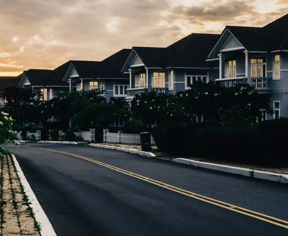 A residential street of San Antonio houses on a clear morning